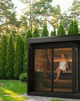 SaunaLife GL6B Outdoor Sauna Garden View with Person Inside Sauna
