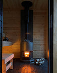 Narvi Luosto VS Sauna Stove view from entry of sauna with wood laying next to heater