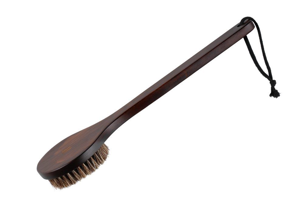 Wooden brush with bristles on a white background