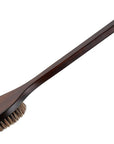 Wooden brush with bristles on a white background