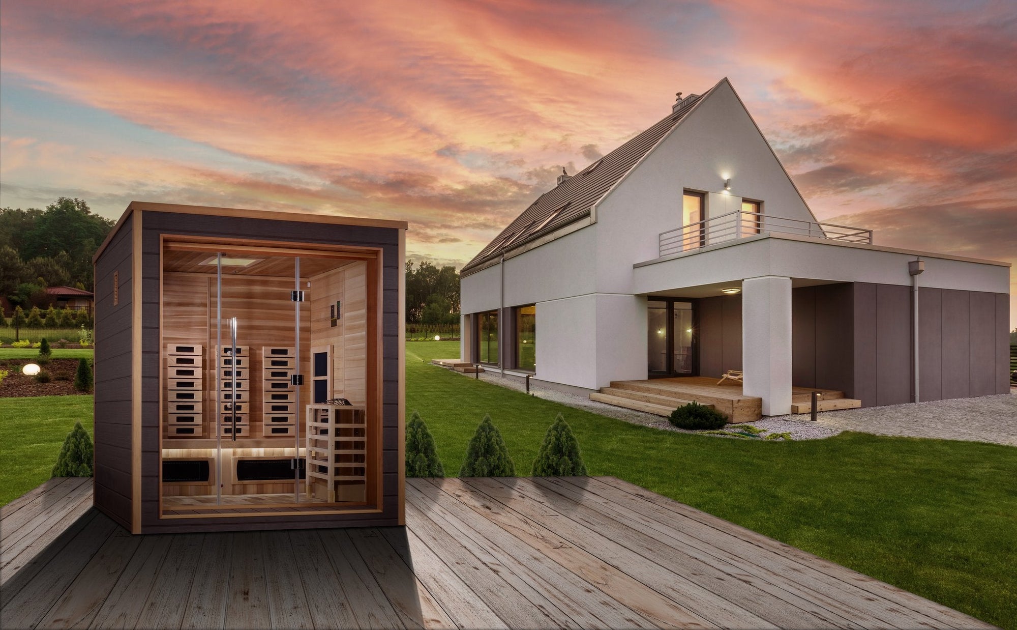 Visby sauna sited beside a house, showing the scale against the building