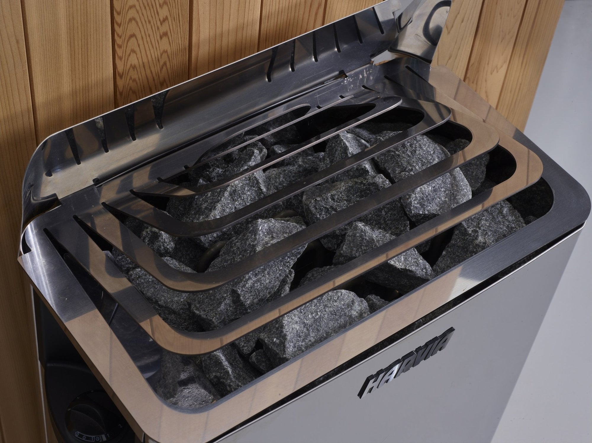Harvia wall stove seen from the side, controls visible