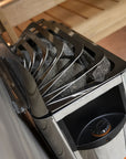 Harvia The Wall Sauna Heater Stainless Steel top view with stones under metal grate