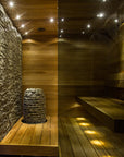 Wooden sauna with stone wall and bench