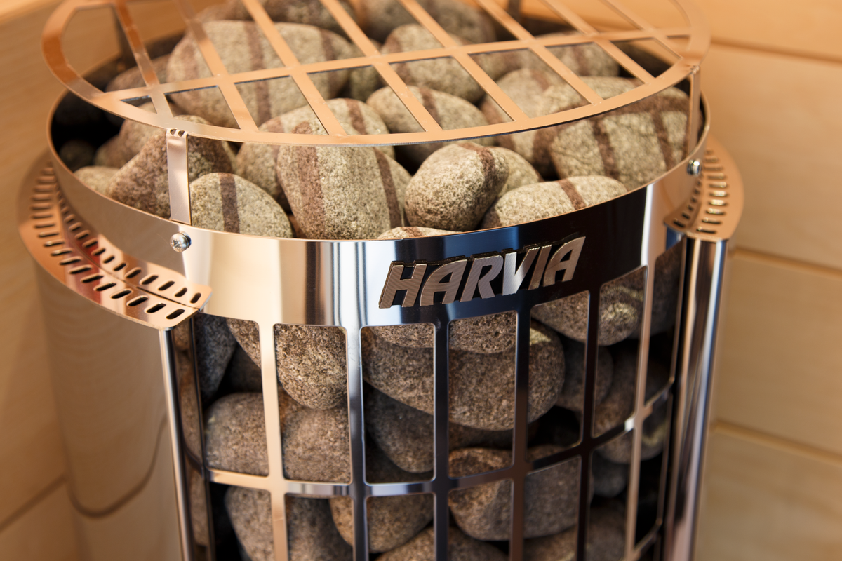 Harvia Cilindro Sauna Heater with close up view of logo and stones underneath stainless steel grate