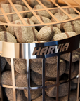Harvia Cilindro Sauna Heater with close up view of logo and stones underneath stainless steel grate