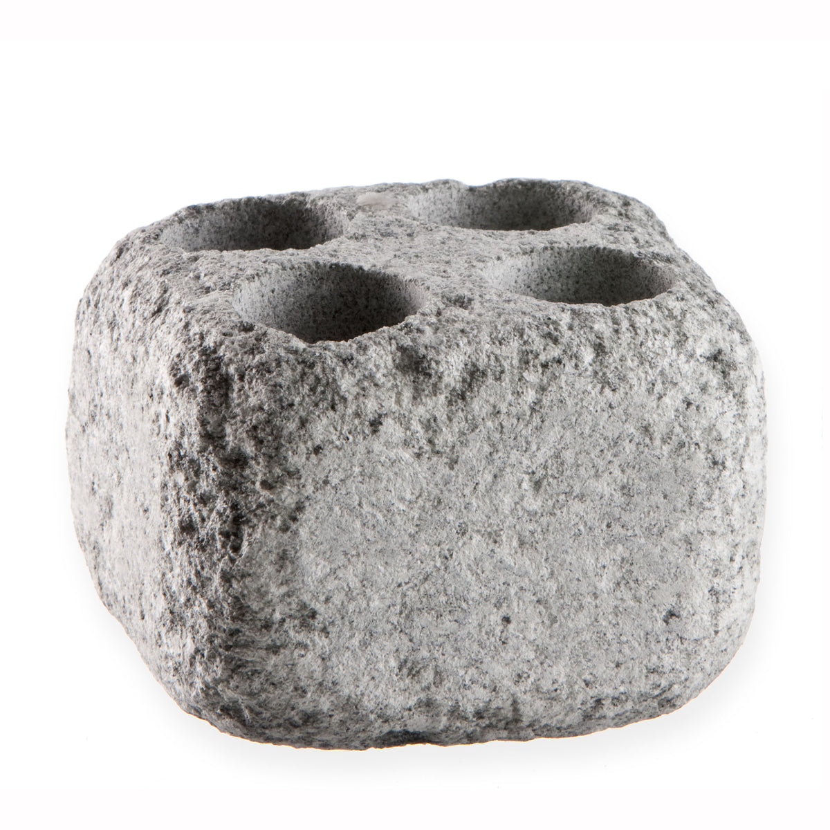 sauna steam stone with multiple holes on a white background