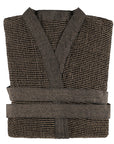 A folded brown textured sauna robe with a matching belt, featuring a V-neck design and horizontal striped weave pattern, shown against a plain white background.