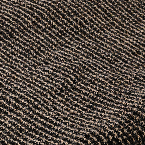 A close-up of a textured woven fabric with a diagonal ribbed pattern in dark brown and beige.