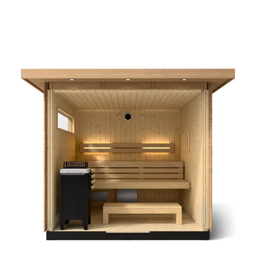 Kohler C2 sauna interior view with light wood with accent lighting on eaves shown with indirect lighting on the back wall, heater and benches