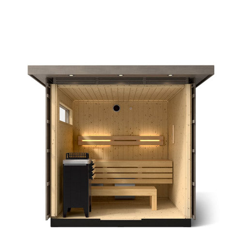 Kohler C2 Sauna Weathered Spruce interior view with indirect lighting on the eaves, heater in the front left and two levels of wooden benches