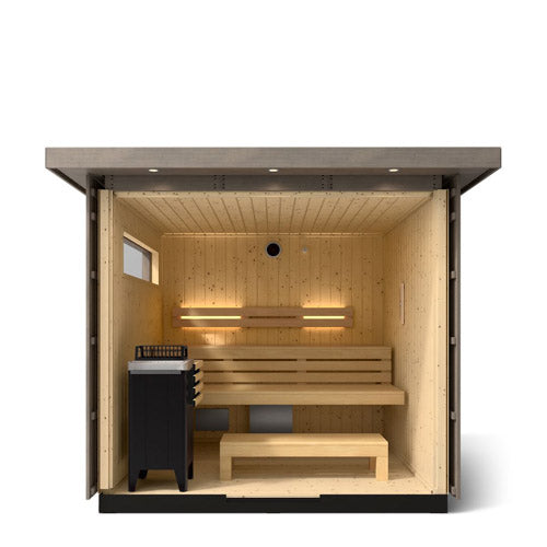 Kohler C2 Sauna Weathered Spruce interior view with indirect lighting on the eaves, heater in the front left and two levels of wooden benches