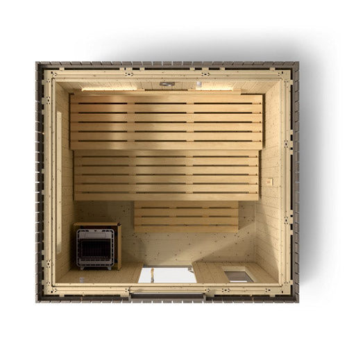 Kohler C2 sauna top view with light wood shown with indirect lighting on the back wall, heater and benches