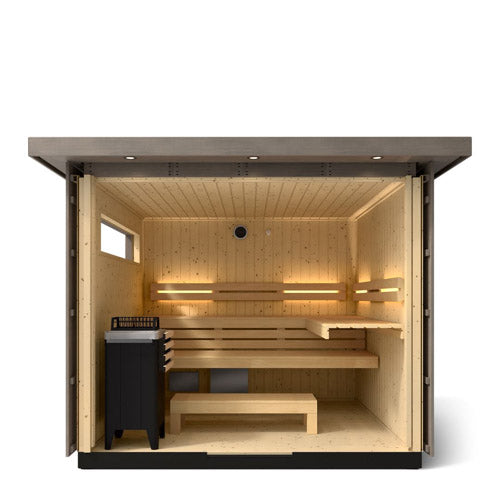Kohler C2 Sauna Weathered Spruce interior view with indirect lighting on the eaves, heater in the front left and two levels of wooden benches
