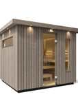 Kohler C2 Sauna Weathered Spruce exterior angled view with indirect lighting on the eaves and a clear glass door