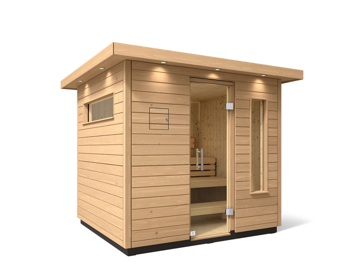 Kohler C2 sauna exterior with light wood angled with accent lighting on eaves and clear glass door