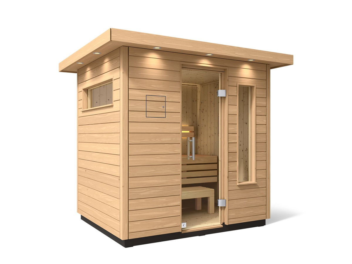 Kohler C2 sauna exterior with light wood angled with accent lighting on eaves and clear glass door