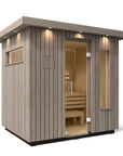 Kohler C2 Sauna Weathered Spruce exterior angled view with indirect lighting on the eaves and a clear glass door