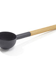 black aluminum ladle with bamboo handle on a white background