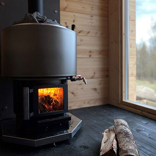 Narvi Luosto VS Sauna Stove view from interior of sauna with wood laying next to heater