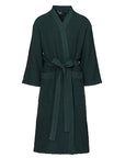 Green sauna robe with a belt on a white background