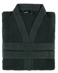 Dark green waffle-textured sauna robe with a belt on a white background