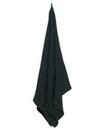 dark green oversized towel on a white background with a loop hook