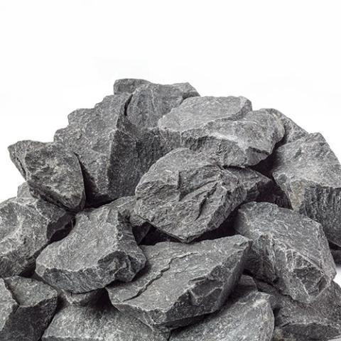 jagged edged grey stones in a pile with a white background