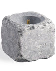 Decorative sauna stone with a brass center nozzle on a white background
