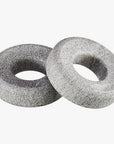 Two gray eye therapy stones on a white background