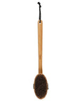 A bamboo-handled body brush with dark brown bristles and a black hanging cord, shown against a plain white background.