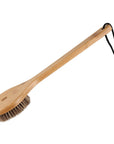 Wooden brush with bristles on a white background